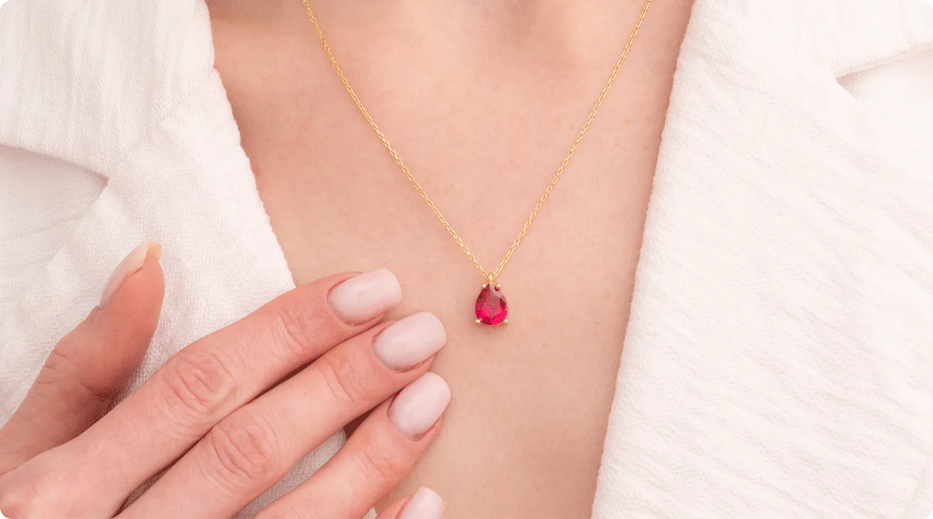 woman wearing a birthstone necklace