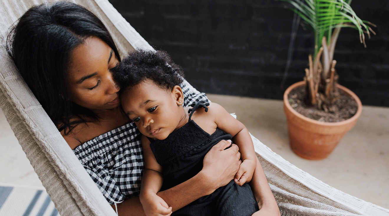 mother comforting toddler daughter