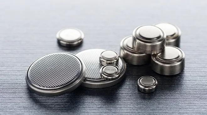 close up of various button batteries for small electronics