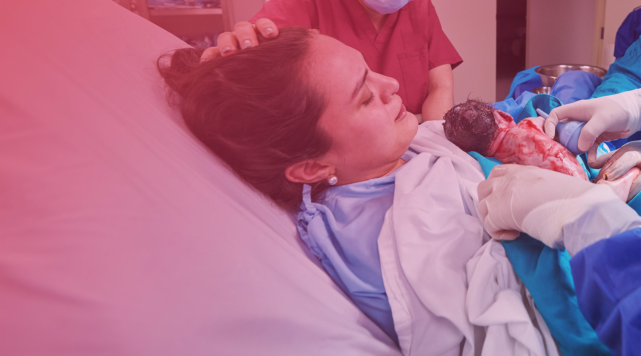 mom delivering baby through c-section