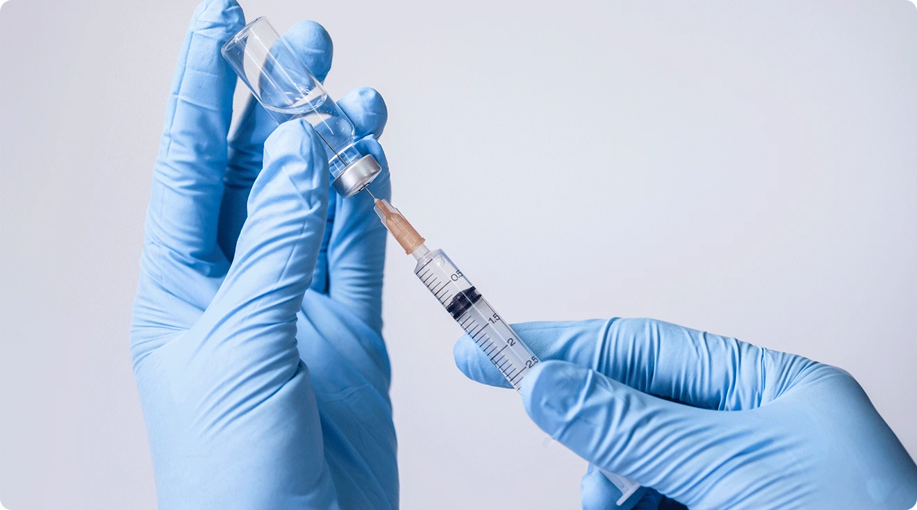 doctor holding vaccine