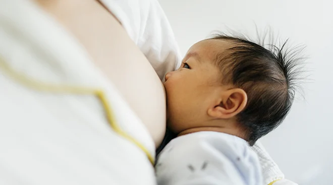 closeup of baby breastfeeding