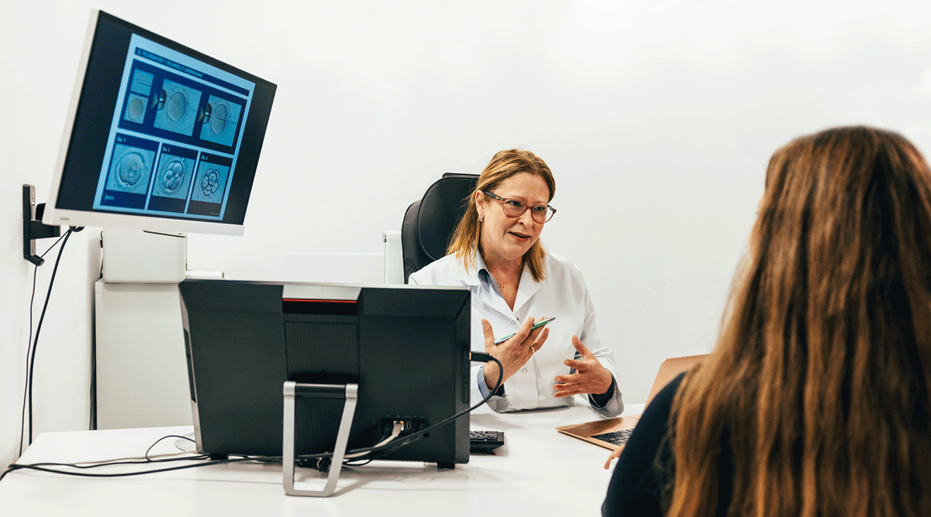 doctor talking to patient about fertility process