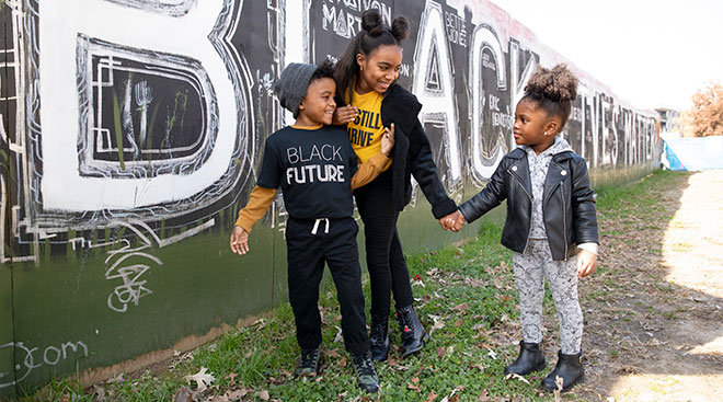 Image shows three young children wearing Target's black history month clothing collection.