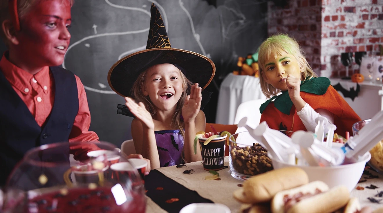 kids in costumes having fun at a halloween party
