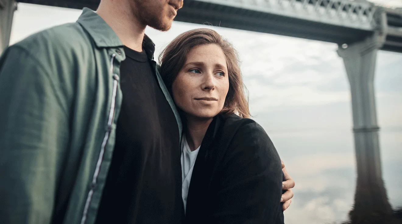 husband hugging worried wife