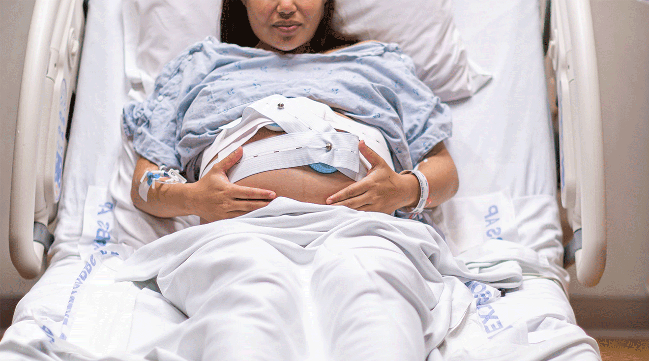 pregnant woman in hospital bed during labor