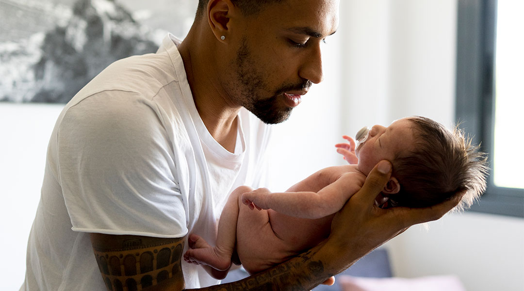 first dad holding his newborn