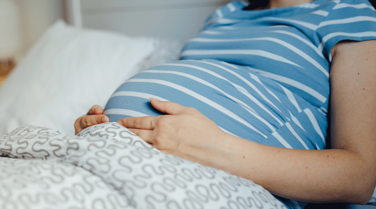 pregnant woman sitting in bed