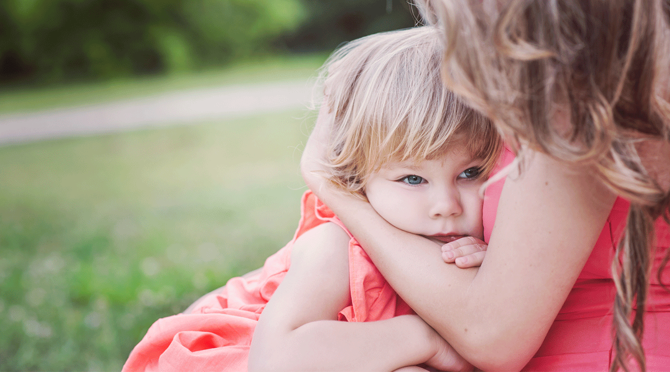 toddler in mom's arms