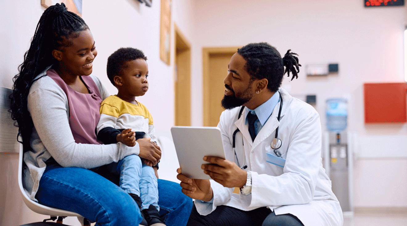 doctor talking to toddler and mom