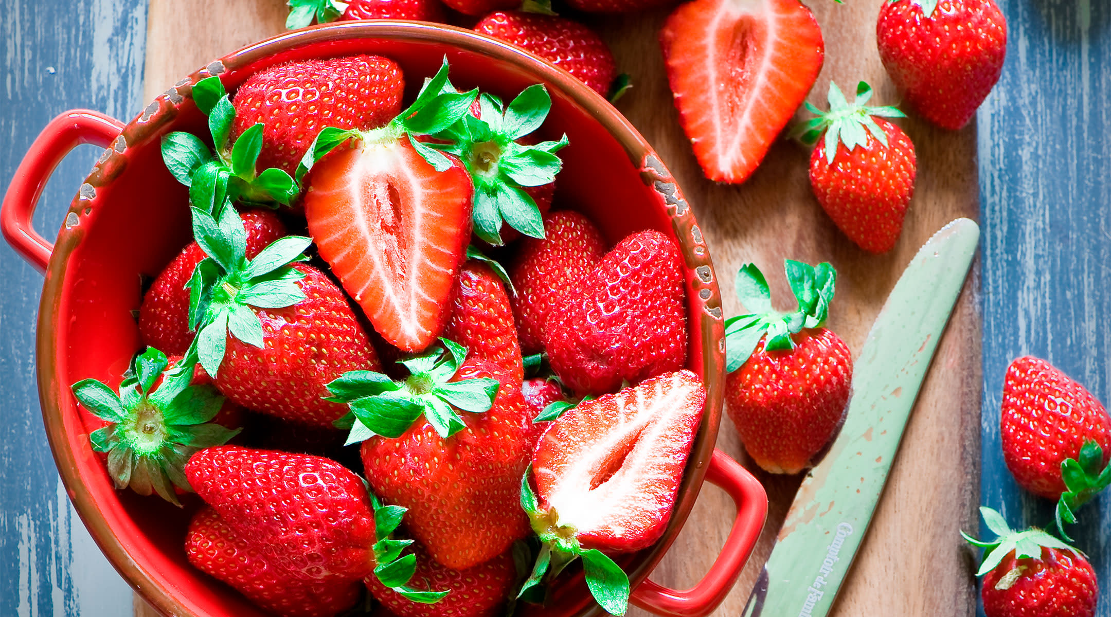 Berry smoothie bowl with fresh sliced strawberries