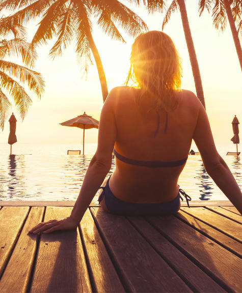 Fashionable Woman Sitting By The Pool On The Empty Deck Stock Photo -  Download Image Now - iStock