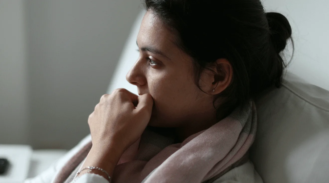 nervous woman thinking at home