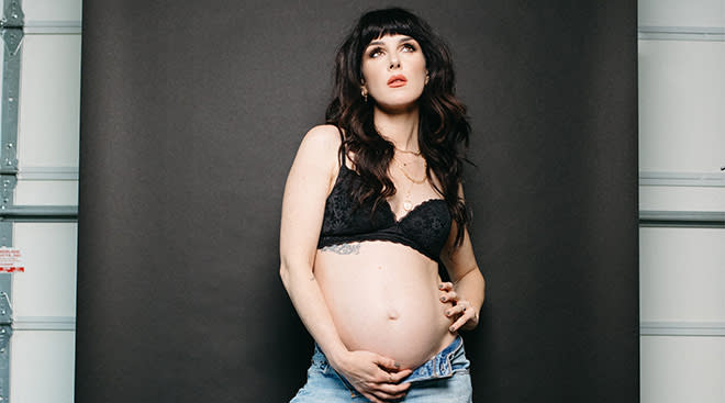 Shenae Grimes displays growing baby bump as she models Calvin