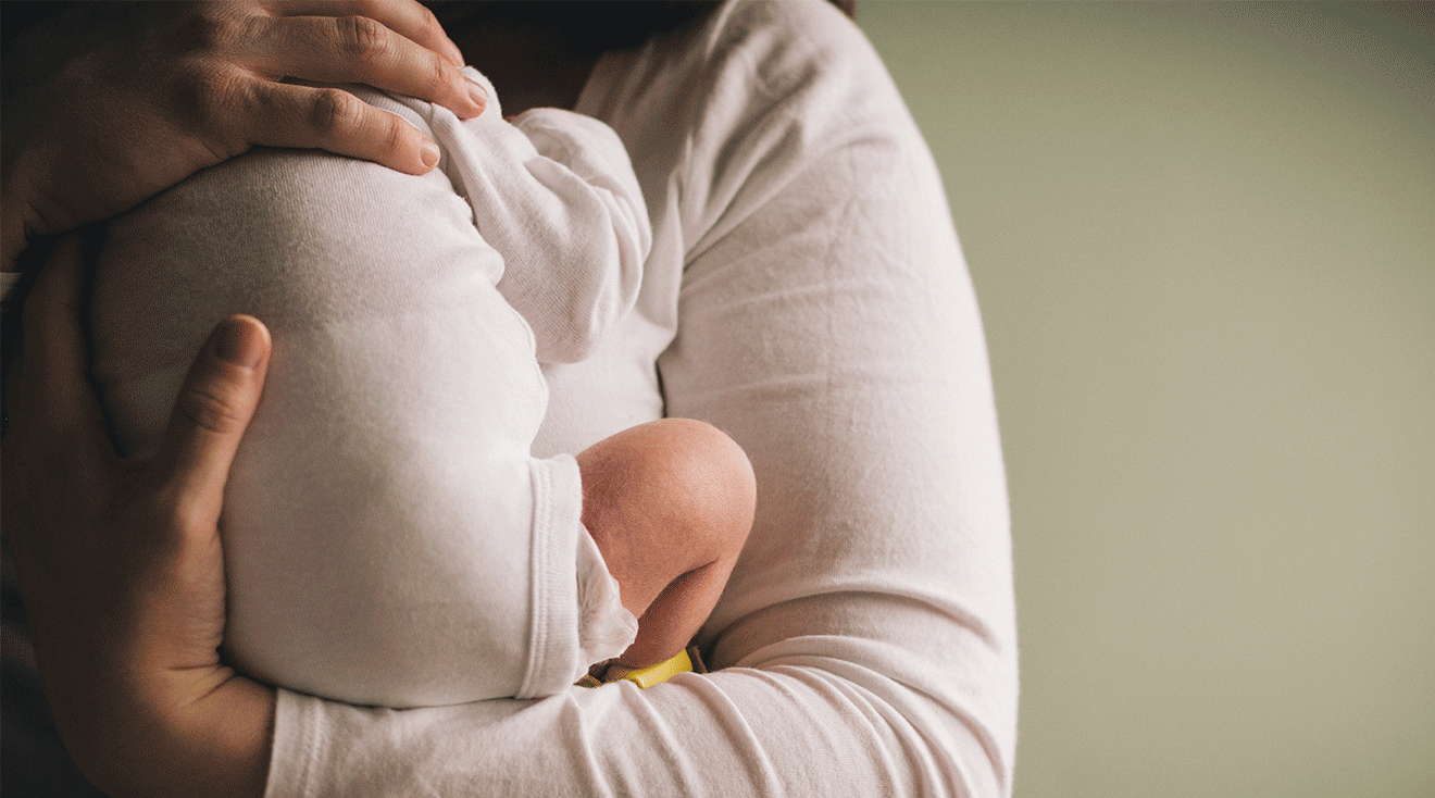 mother holding newborn baby