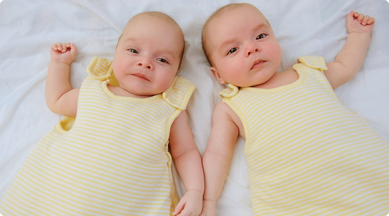 twin babies in sleep sacks