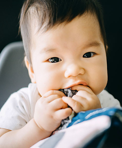 Fussy baby best sale chewing on hands