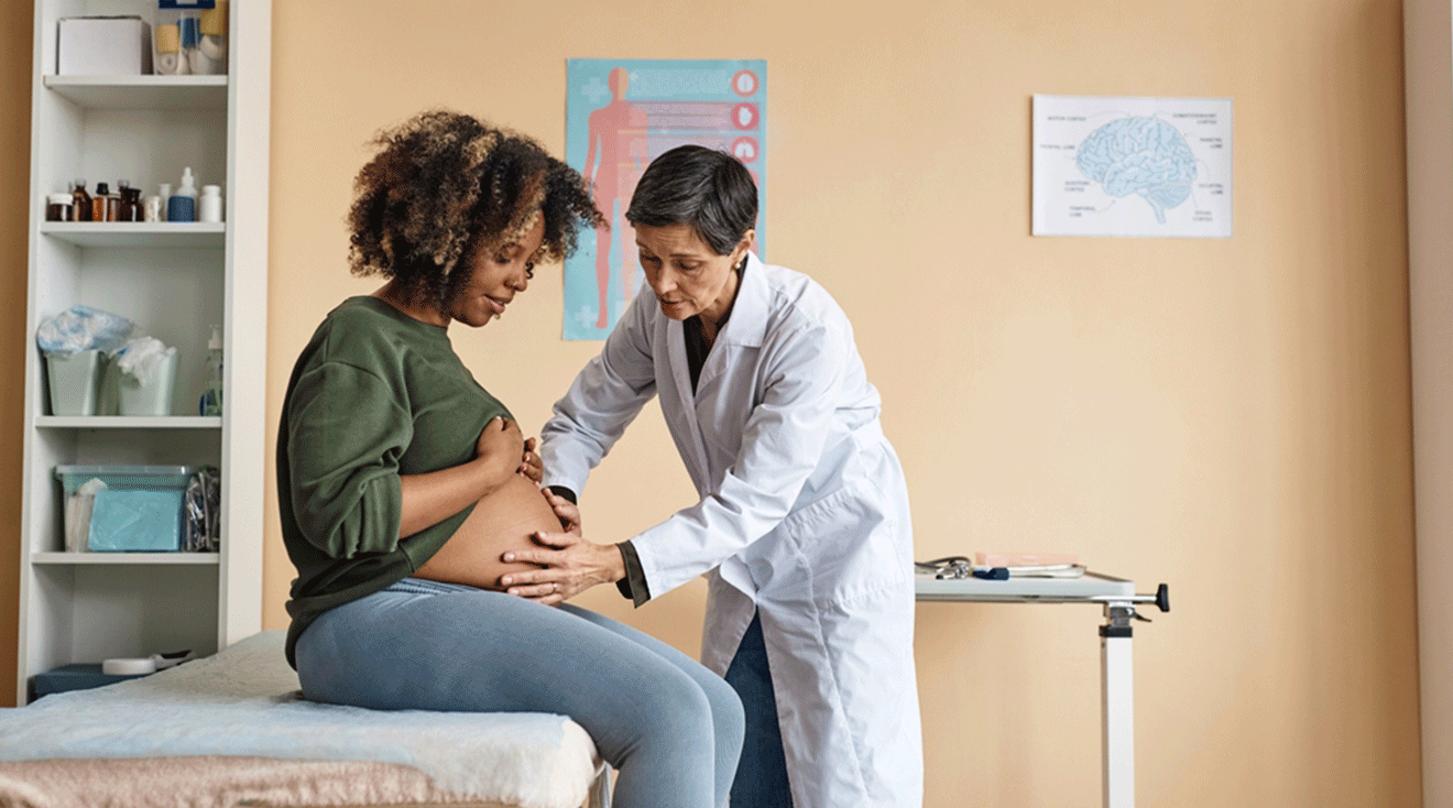 doctor checking pregnant woman