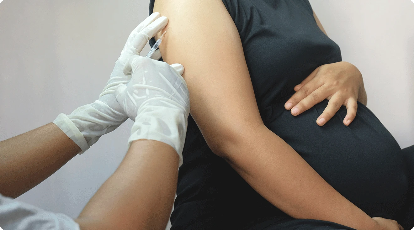 pregnant woman getting a vaccine