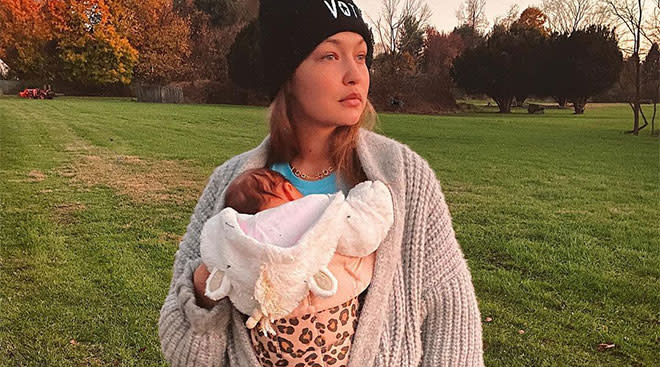 model gig hadid pictured carrying her newborn baby outside in a field