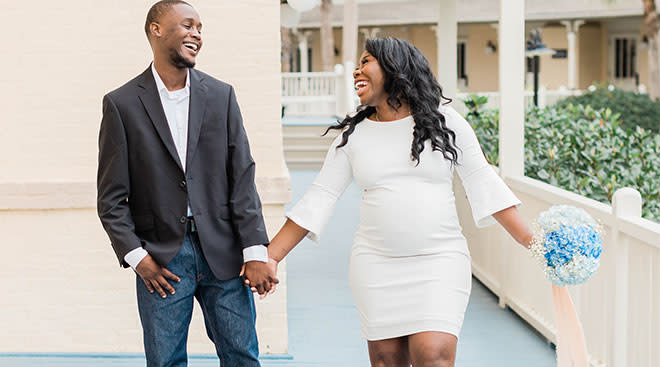 pregnant woman laughing with her partner