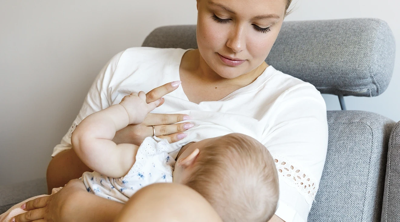 young mother breastfeeding baby