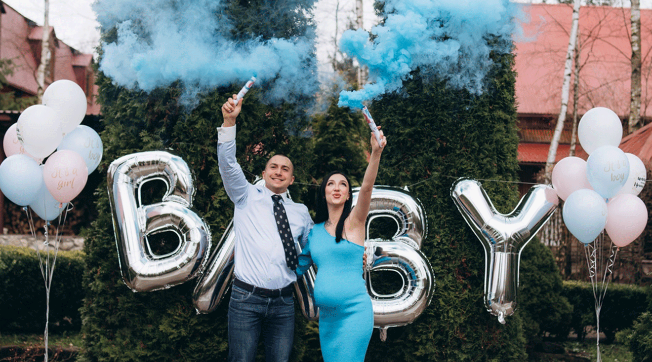 pregnant couple doing a gender reveal for their baby