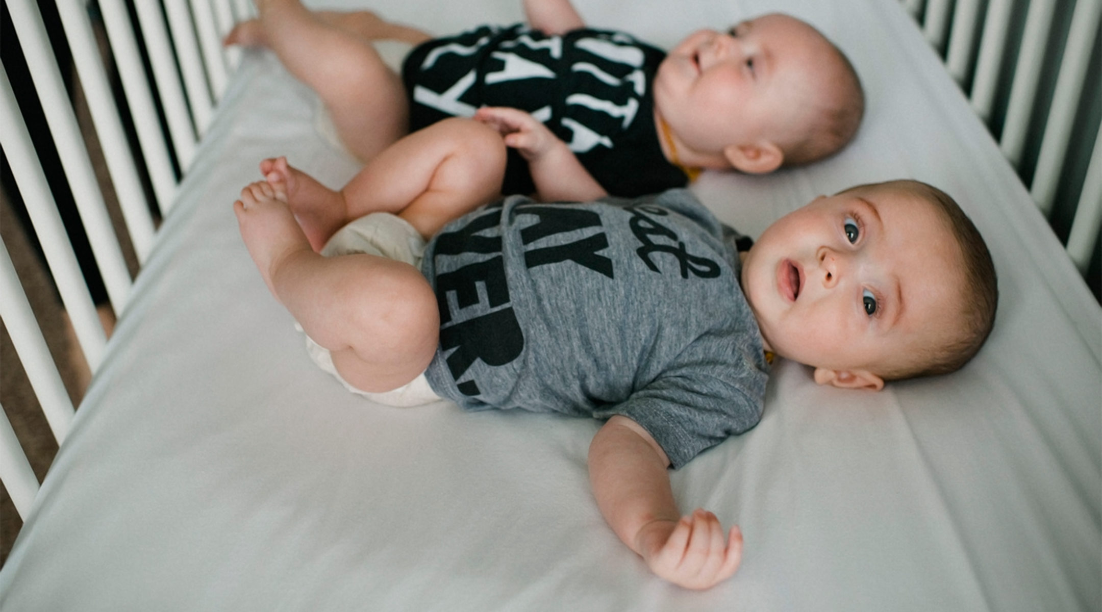 twins in their crib