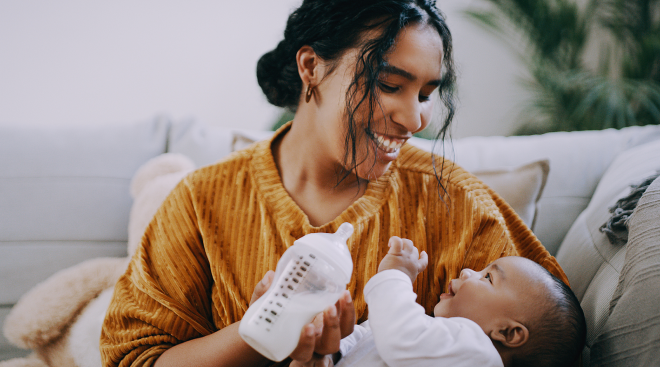 mom feeding baby with bottle