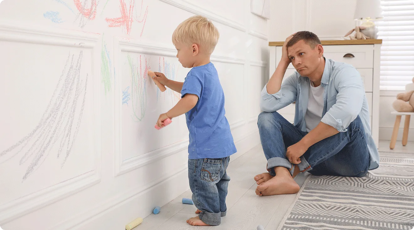 father watching toddler draw on the walls FAFO parenting style