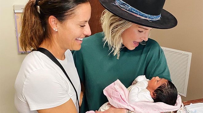 Women's professional soccer players Ashlyn Harris and Ali Krieger adopt a newborn baby.