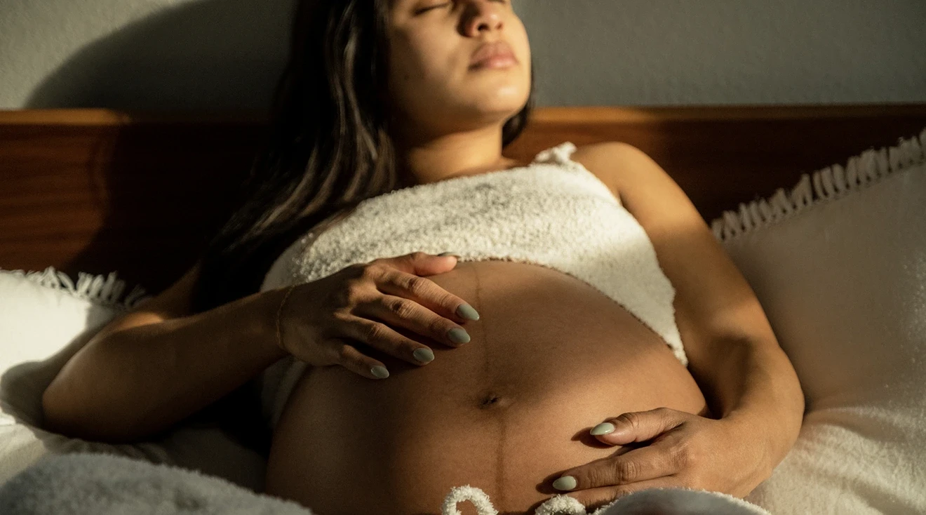 pregnant woman resting in bed