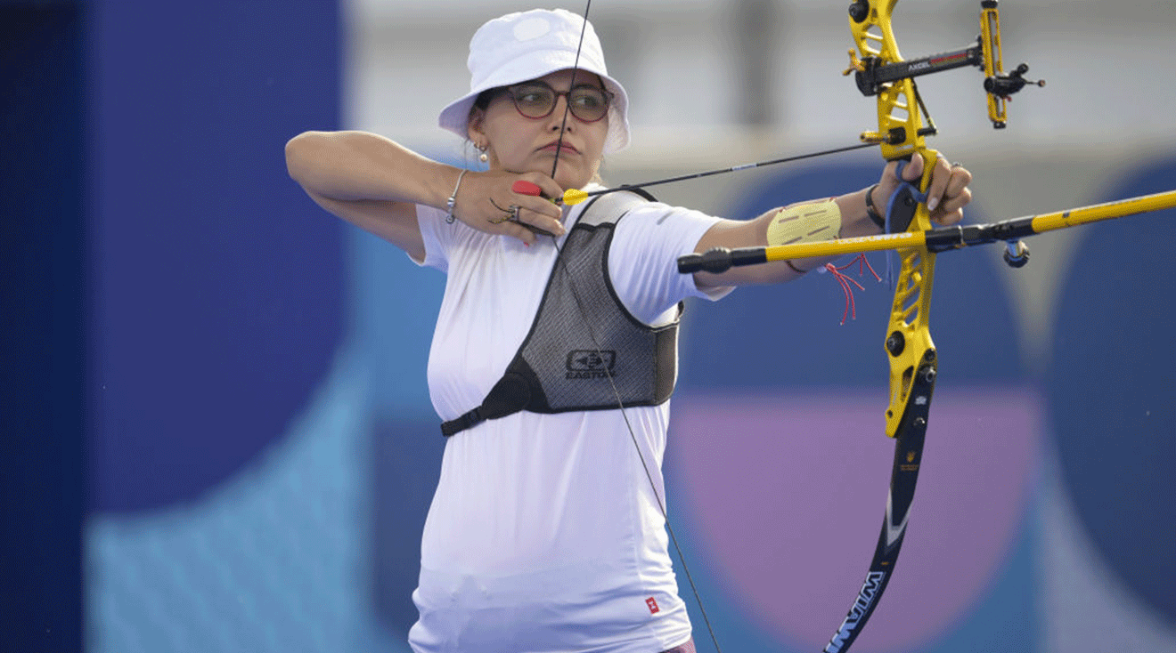 Yaylagul Ramazanova of Azerbaijan competes against An Qixuan (not seen) of China in the Archery Women's Individual qualifying round during the Olympic Games Paris 2024 at Esplanade Des Invalides on July 30, 2024 in Paris, France