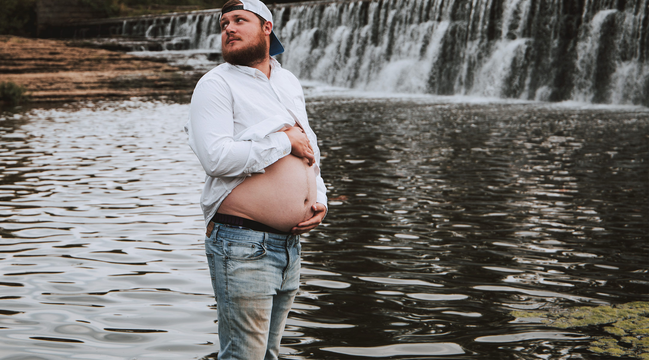 Pregnant belly. Husband and wife getting ready in the morning photo.