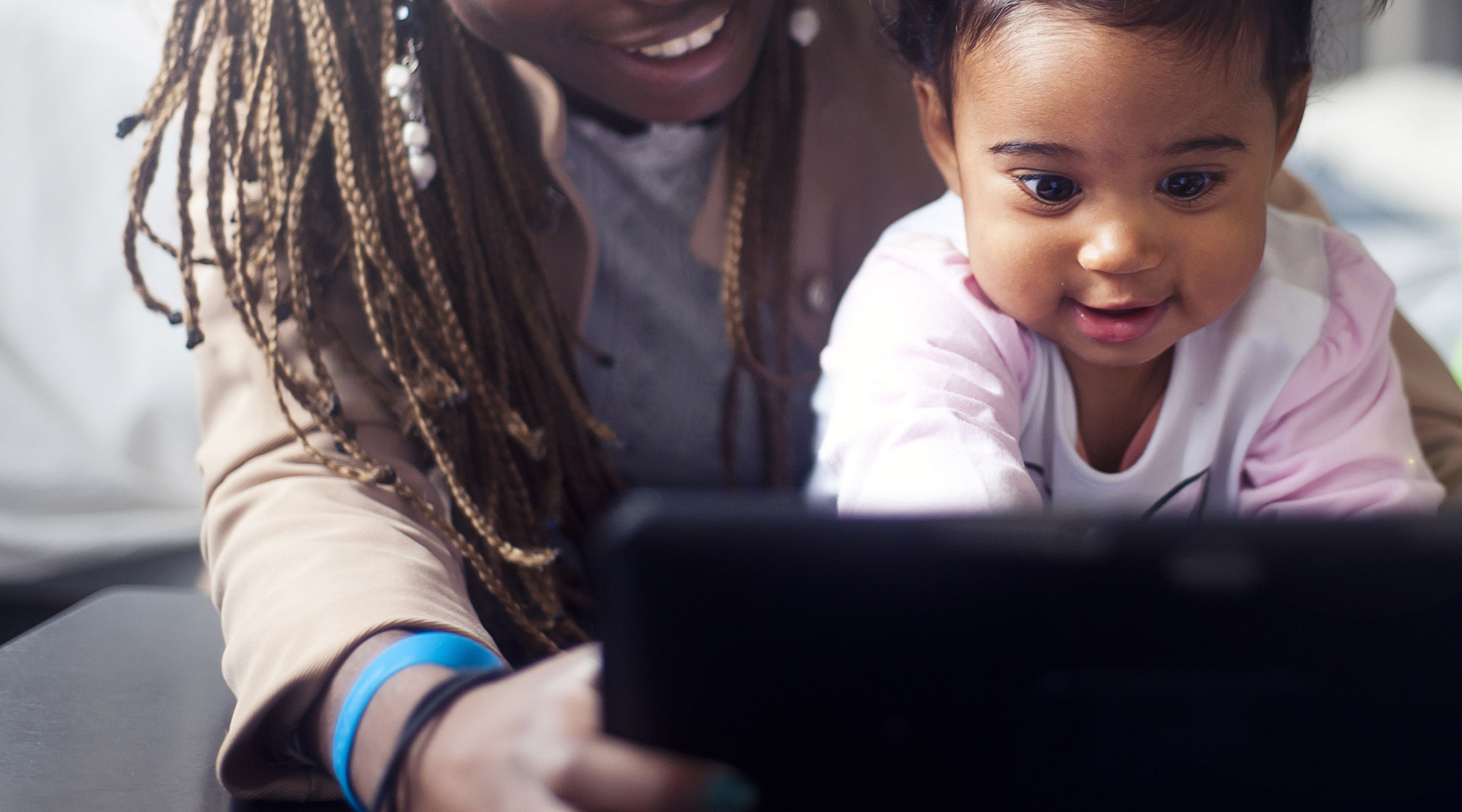 Toddler having screen time with mom