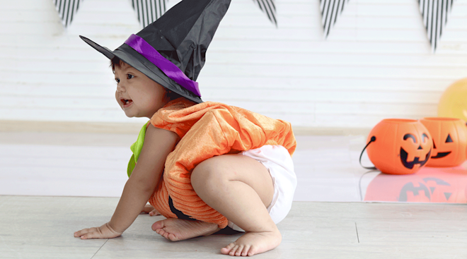 baby in a witch costume