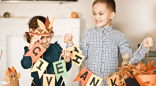 young children making thanksgiving arts and crafts at home