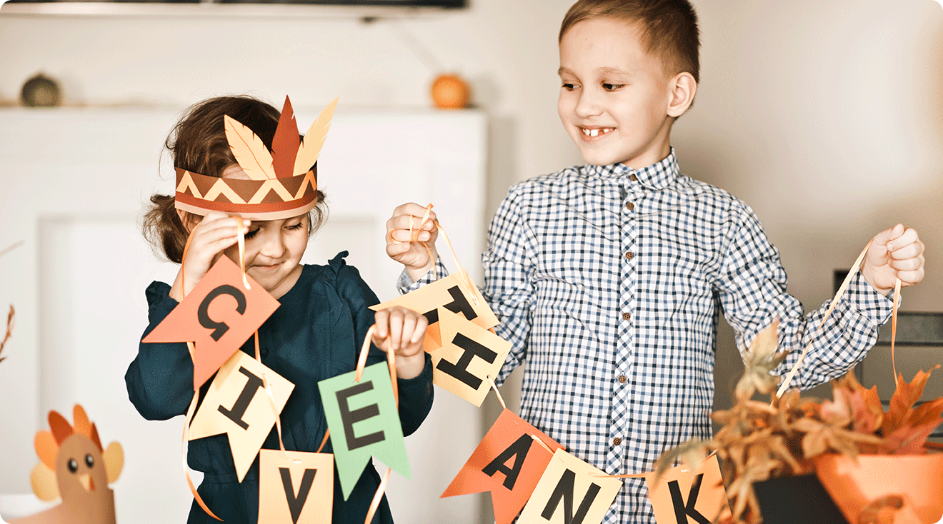young children making thanksgiving arts and crafts at home