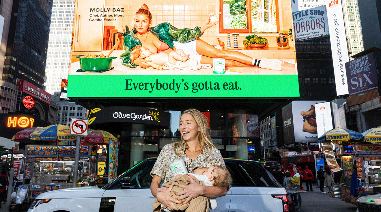 Molly Baz breastfeeding in front of times square billboard for bobbie