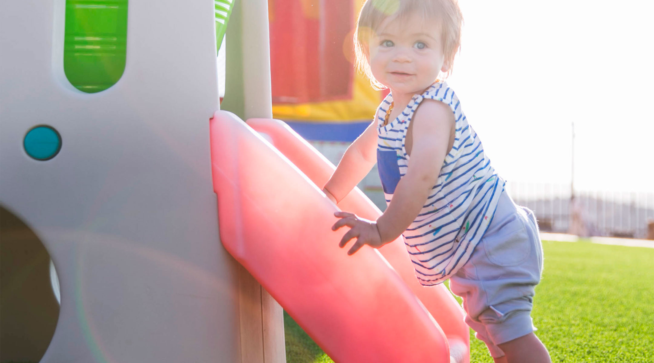 toddler playing outside on playground