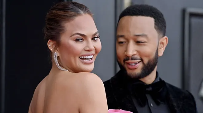 Chrissy Teigen and John Legend at the 64th Annual GRAMMY Awards at MGM Grand Garden Arena on April 03, 2022 in Las Vegas, Nevada