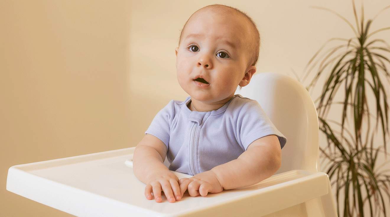 baby sitting in high chair