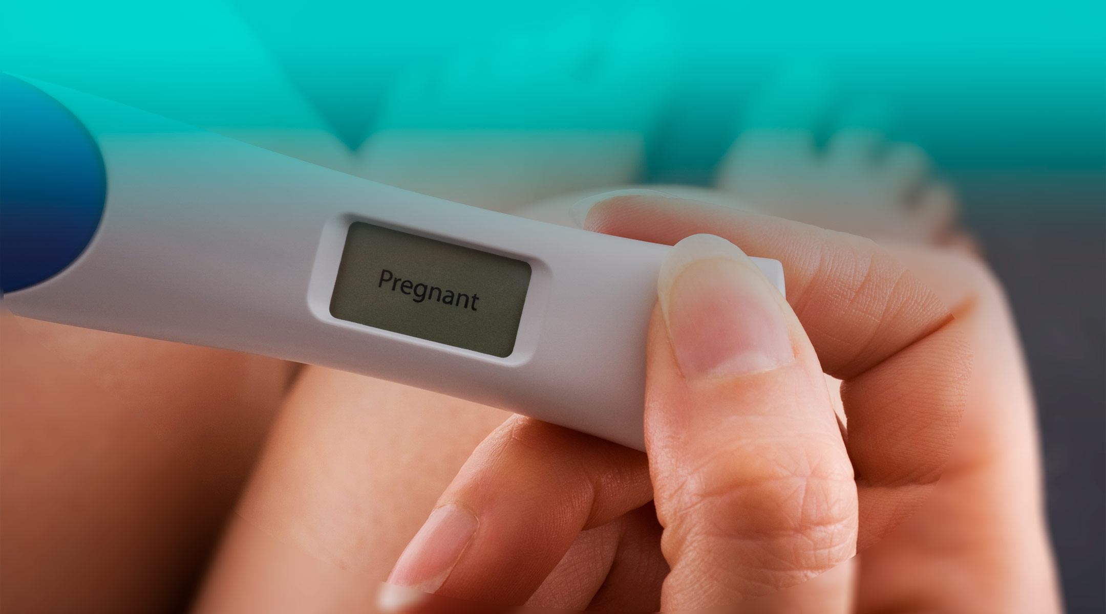 woman holds positive pregnancy test