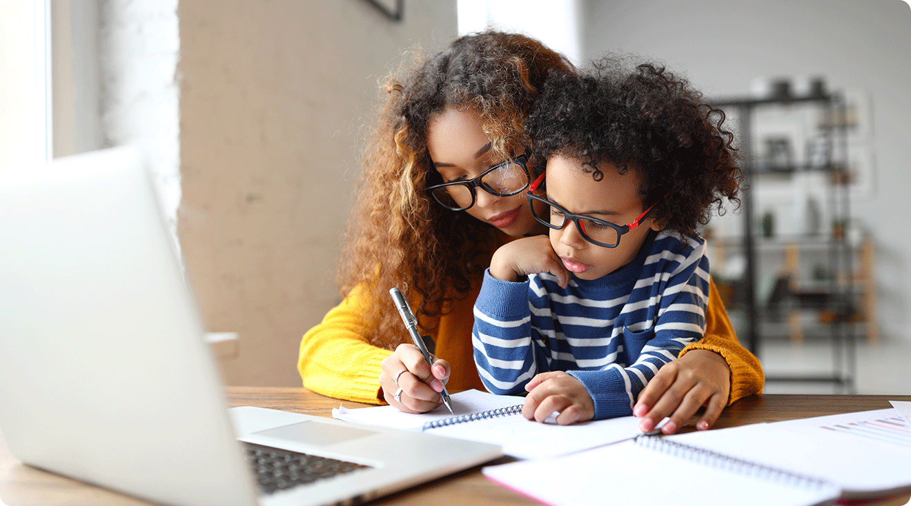 mom helping child do school work at home