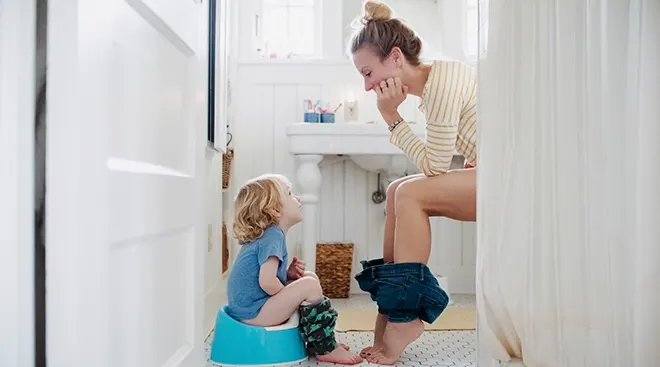 mother toilet training baby