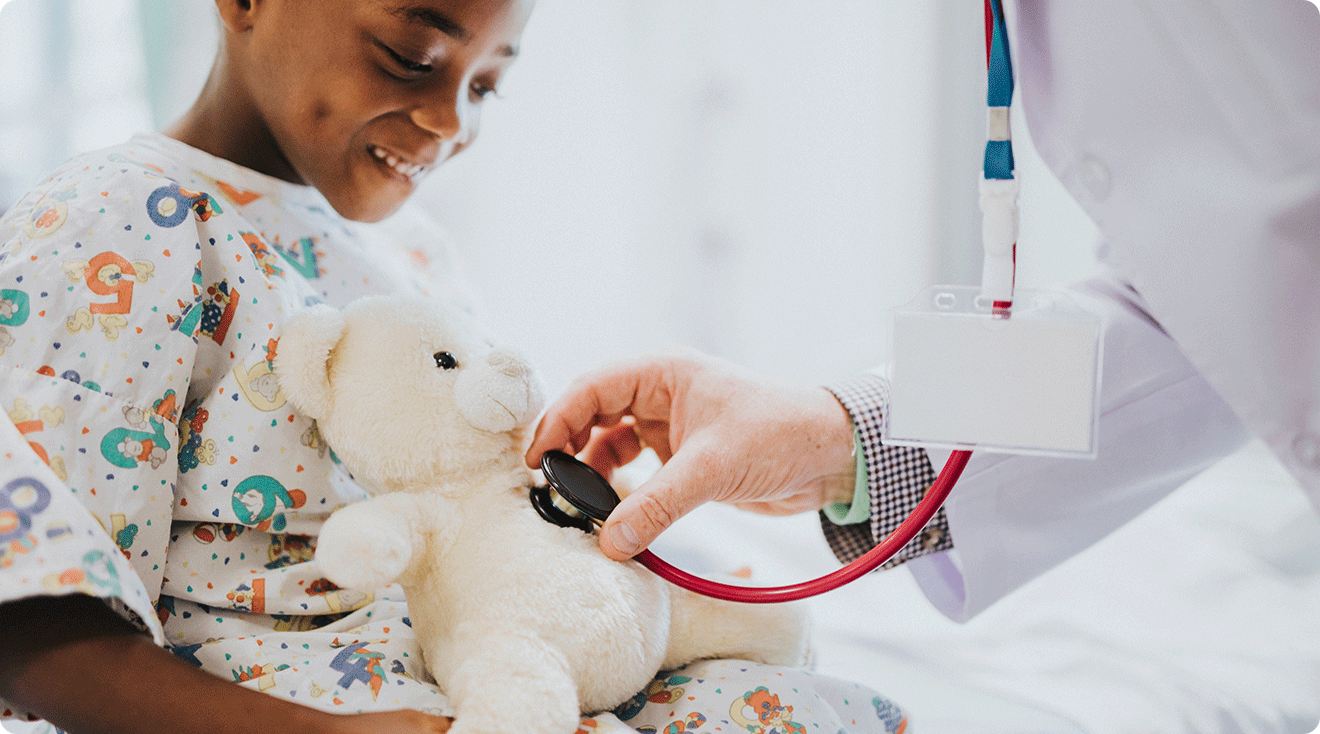 child in childrens hospital with stuffed animal