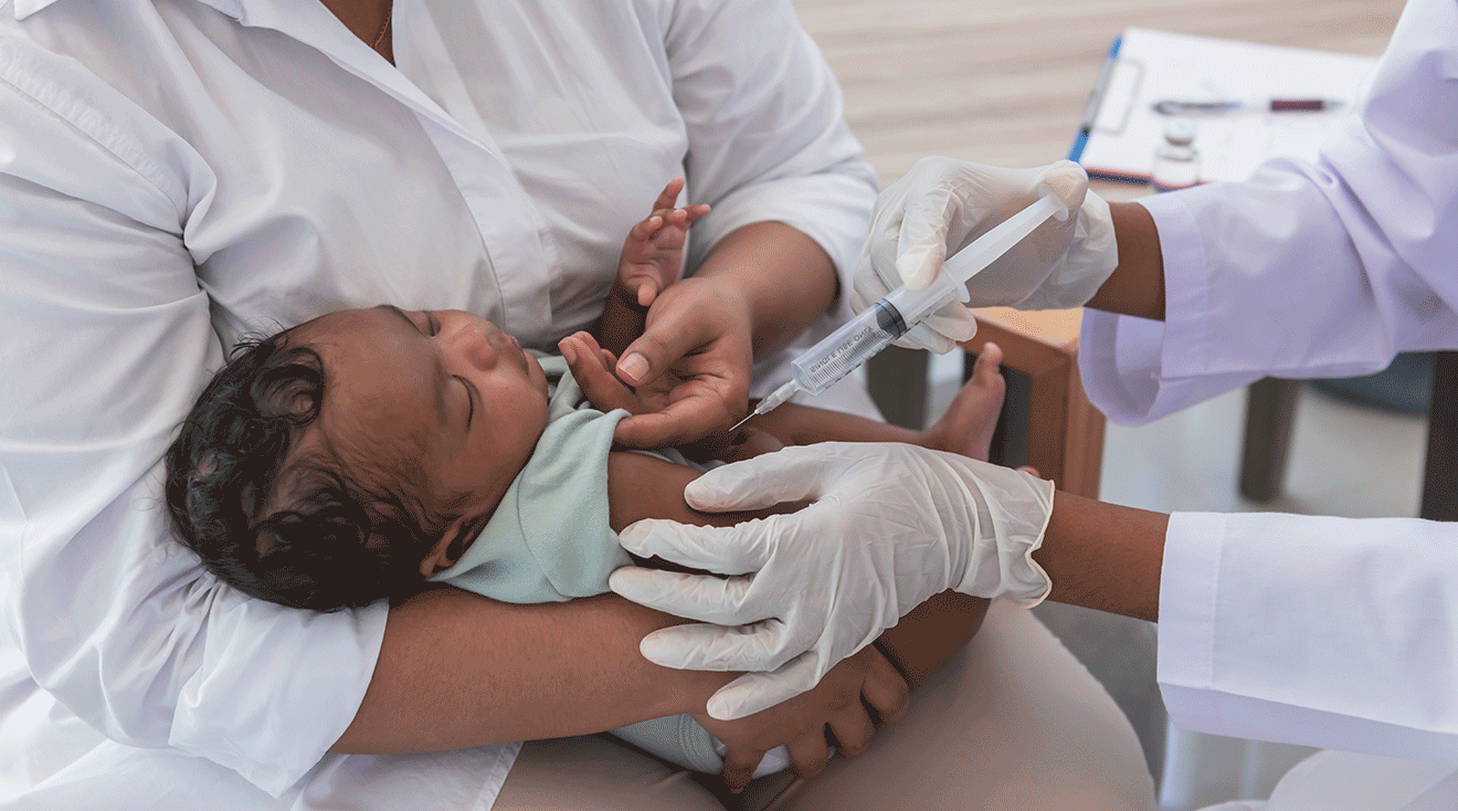 doctor giving vaccine to baby