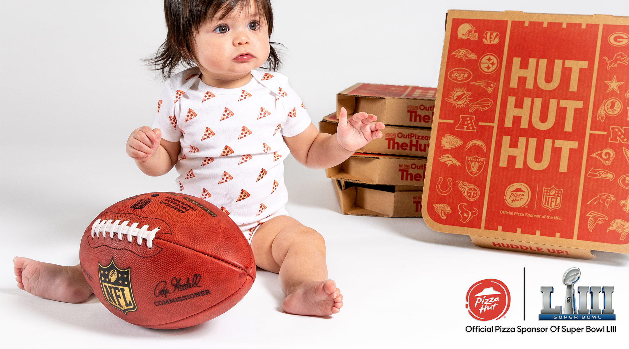 baby pictured with pizza hut boxes for deal pizza hut is offering, free pizza for one year first baby born after kick off