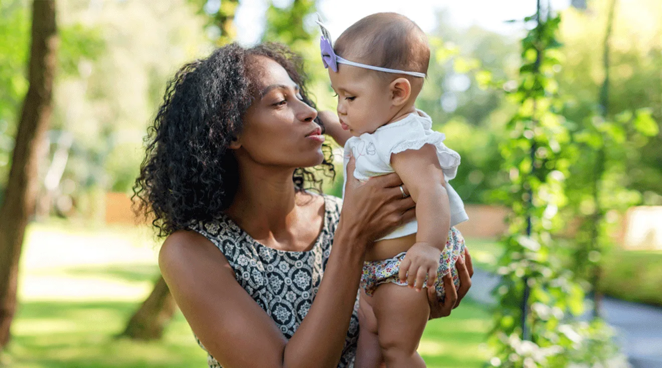 mom and baby outside during summer